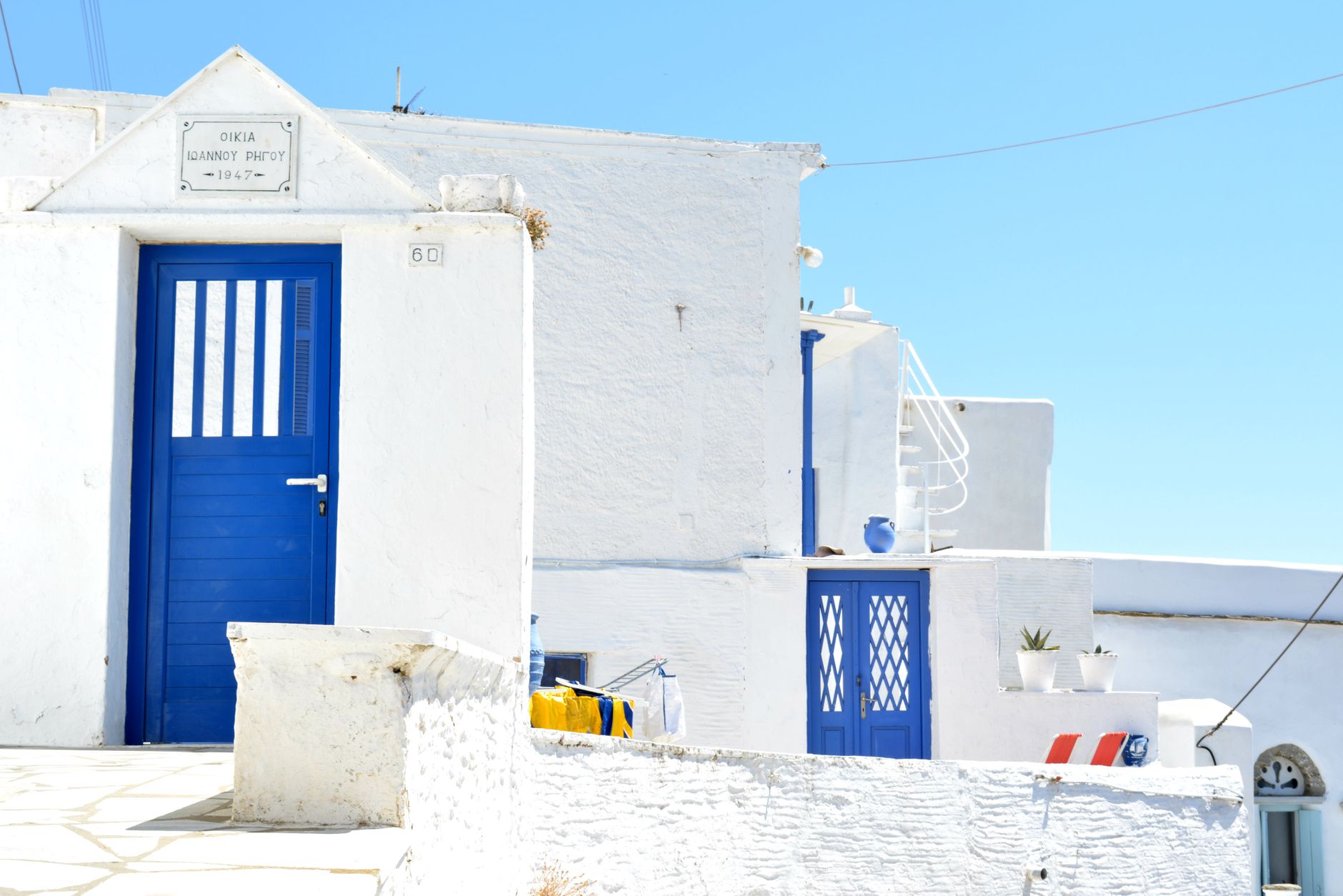 Cyclades whitewashed village bar terrace